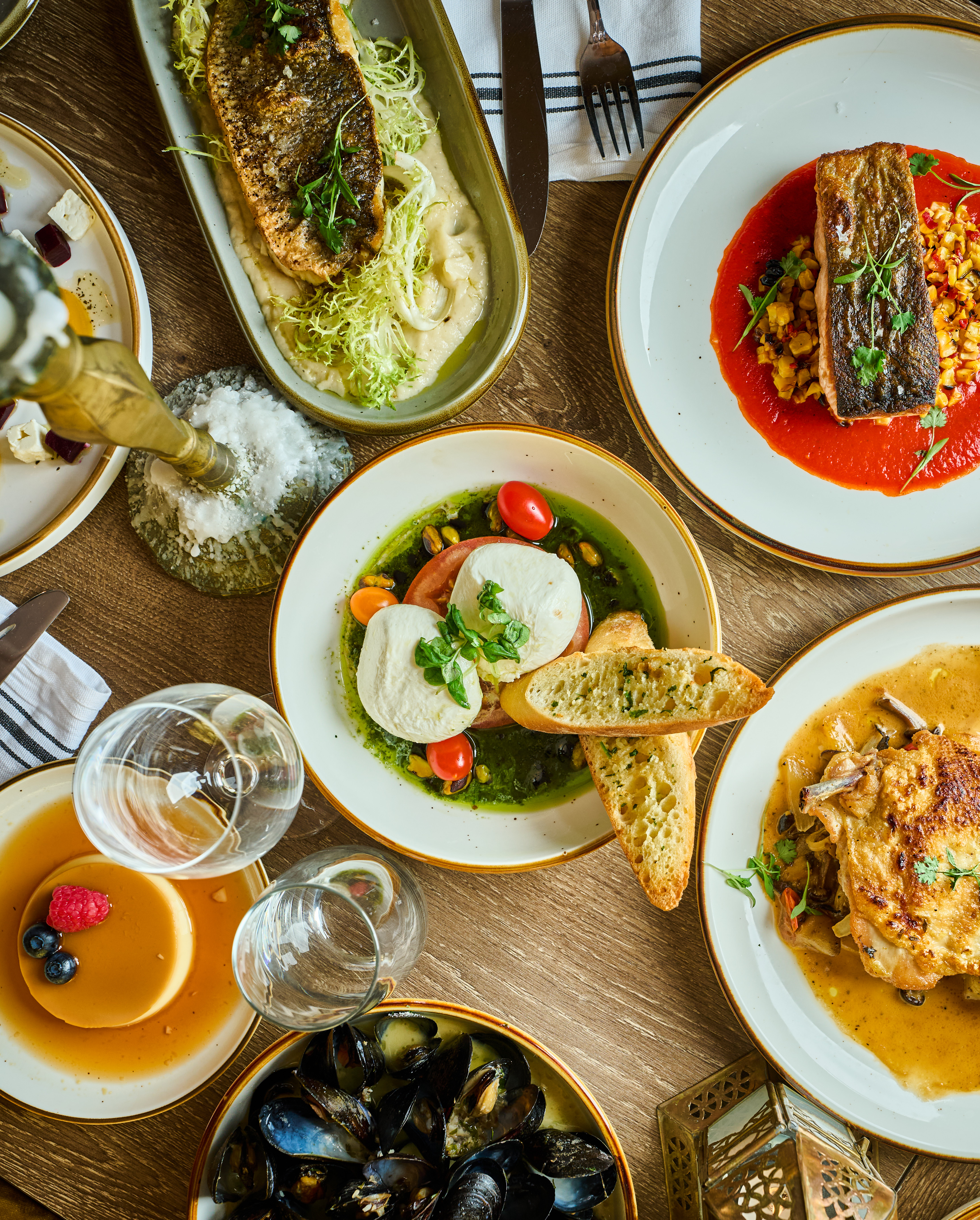 a bowl of food on a plate on a table