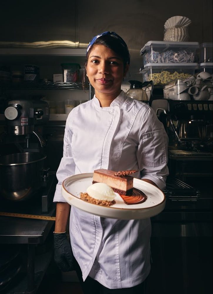 a person holding a plate of food