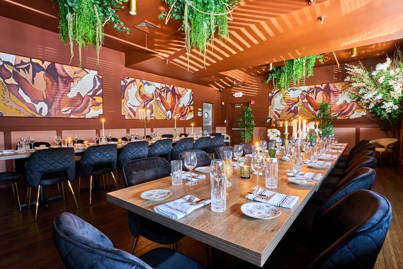 a group of people sitting at a table in a restaurant