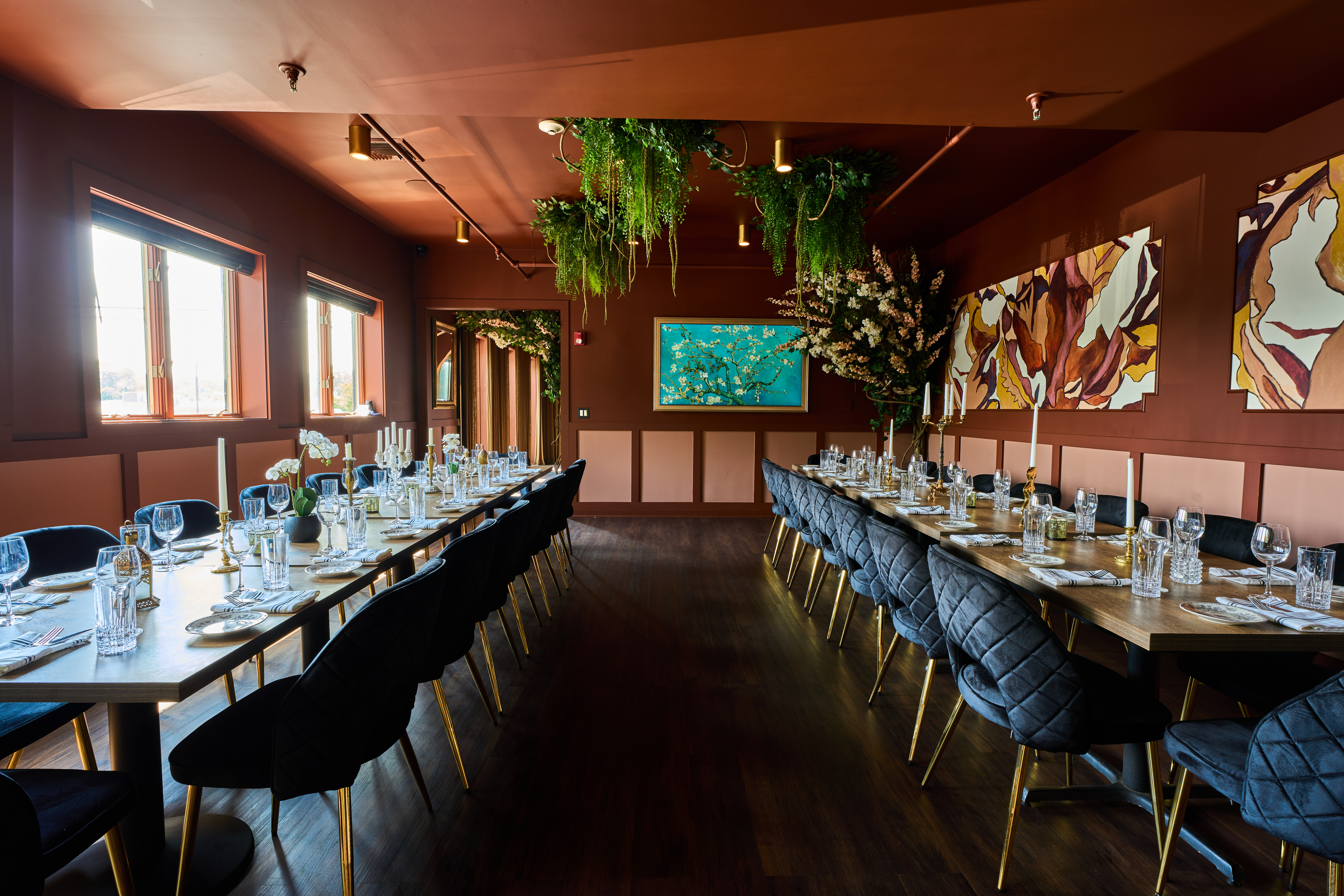 a room filled with furniture and vase of flowers on a table