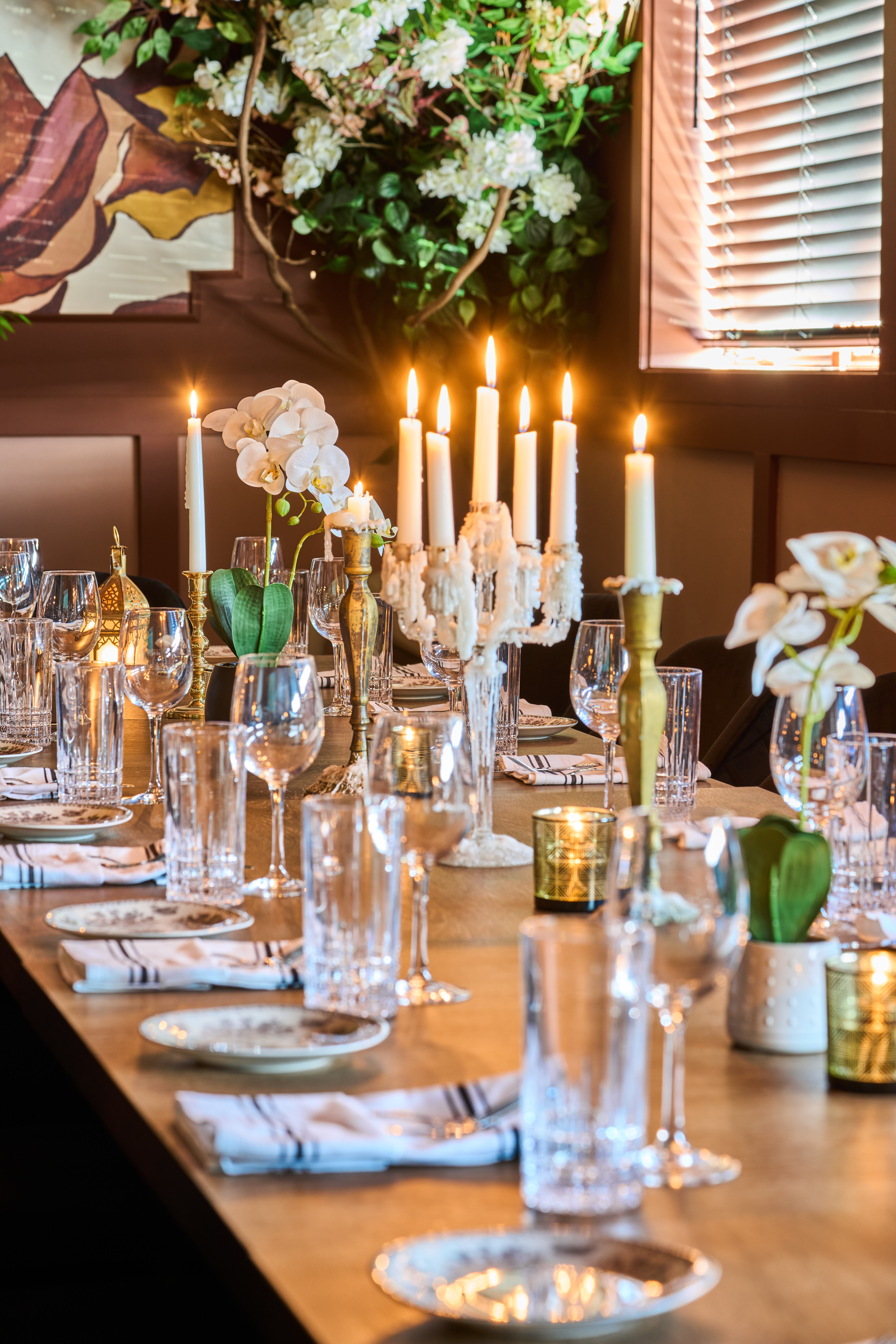 a group of people sitting at a table with wine glasses