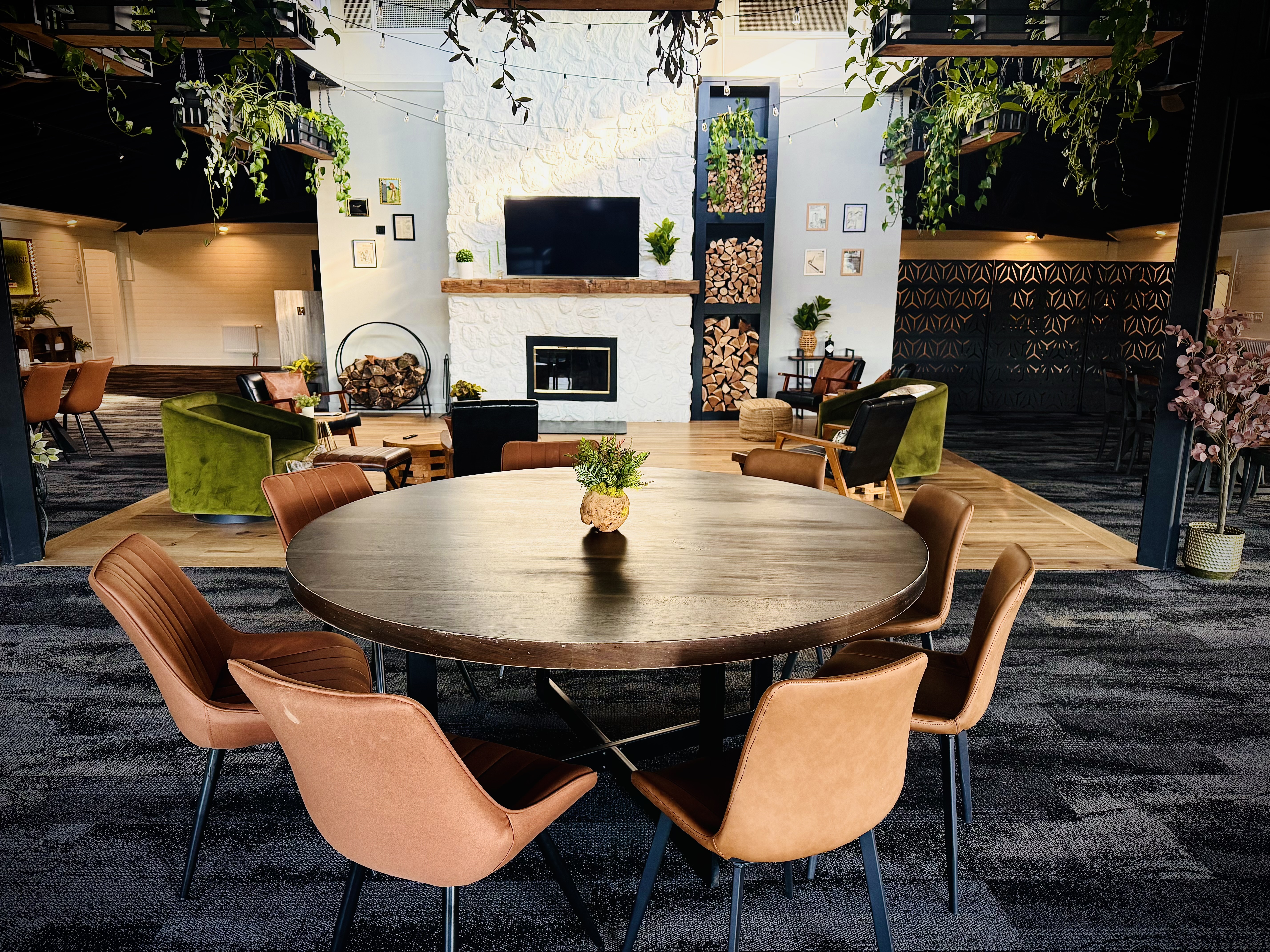 a room with a round table and chairs