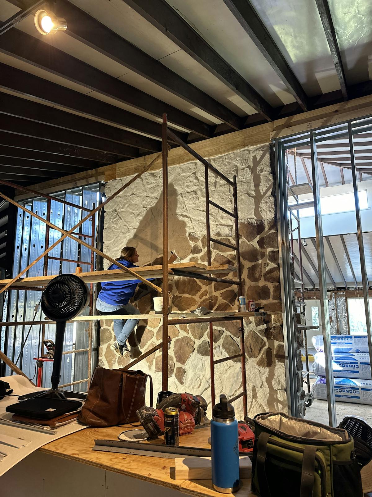 a room filled with furniture and a large window