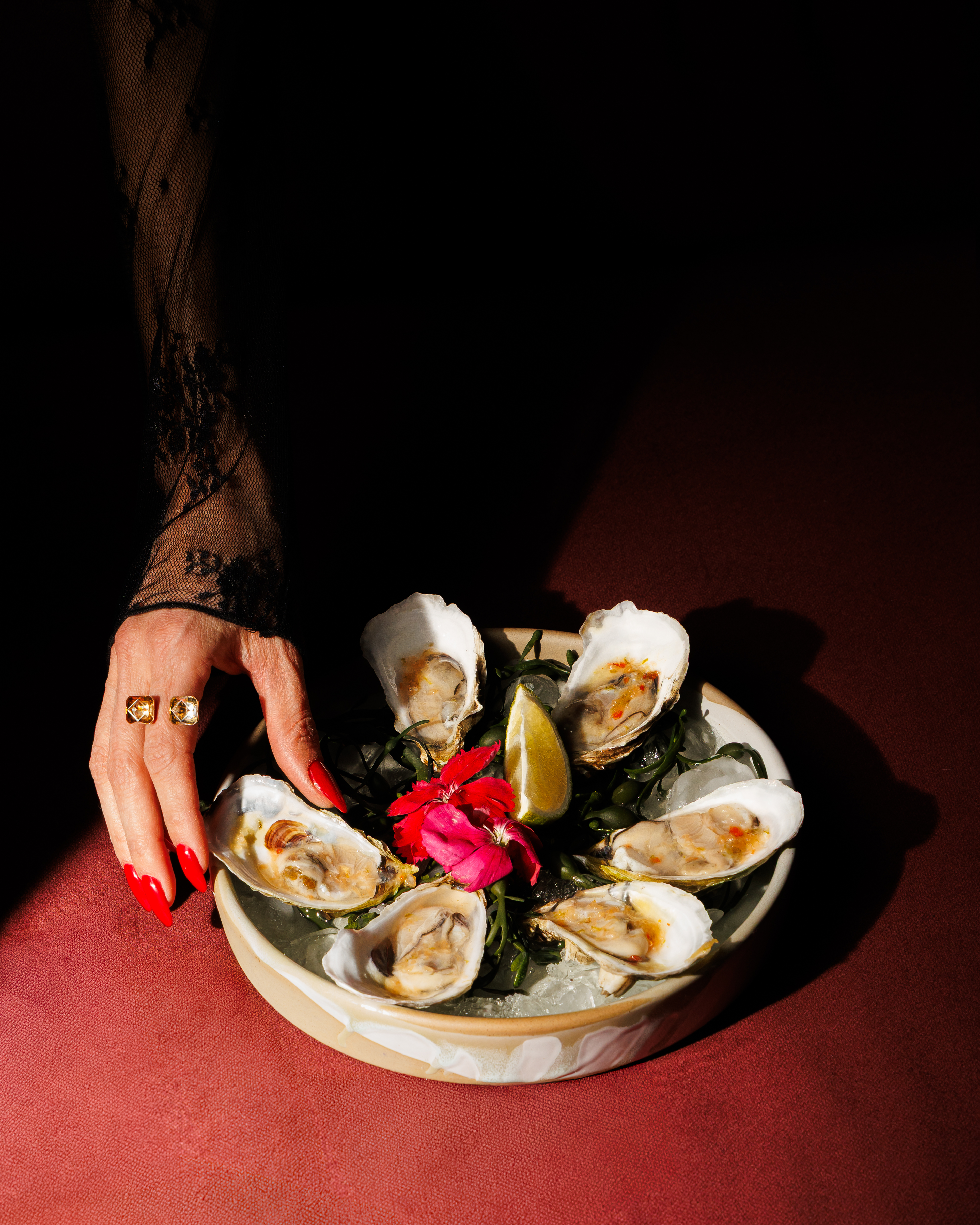 a person sitting at a table with a plate of food