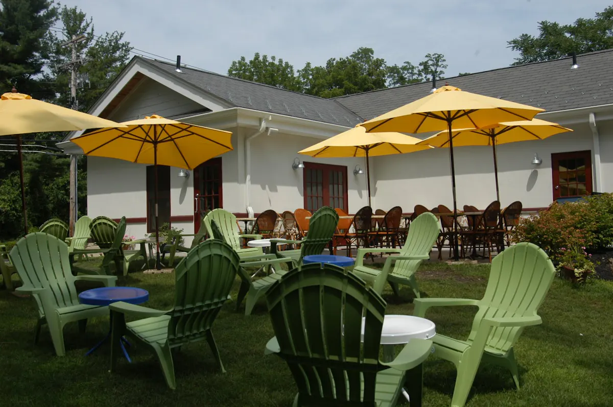 a group of lawn chairs sitting on top of a picnic table