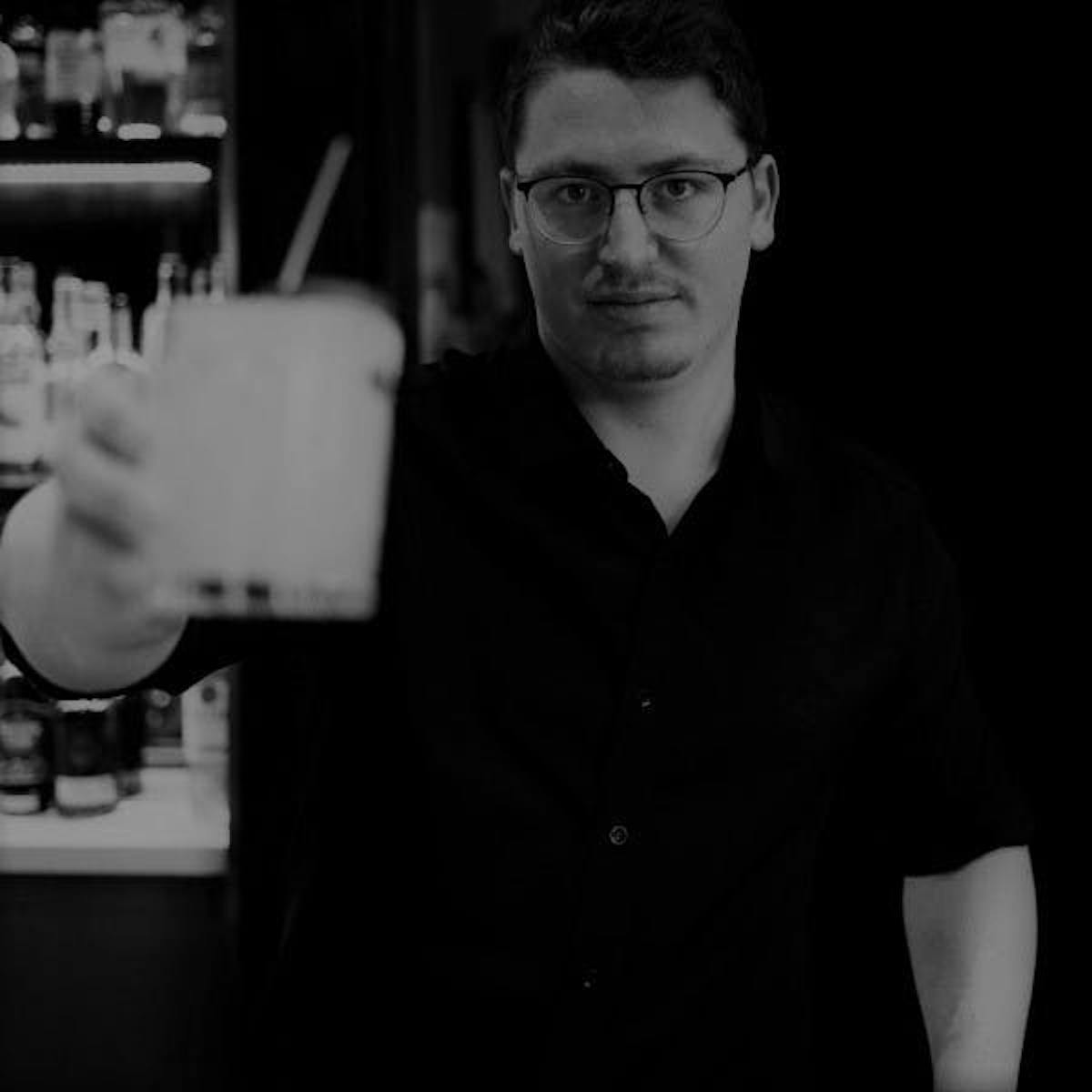 a man holding a wine glass