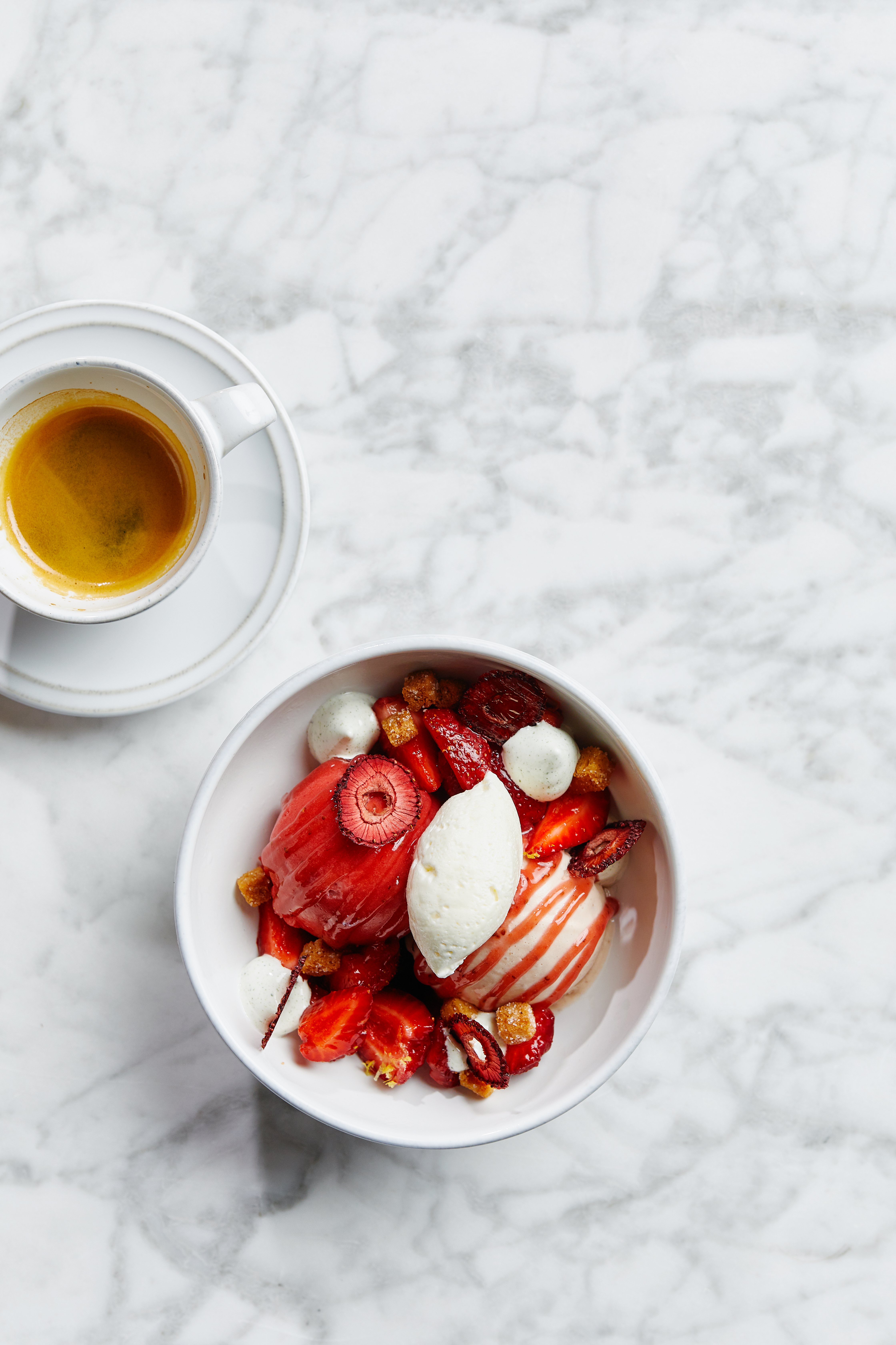 a plate of food and a cup of coffee