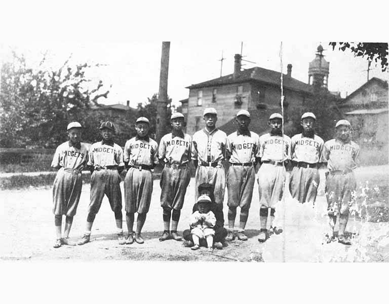 a vintage photo of a group of people posing for the camera