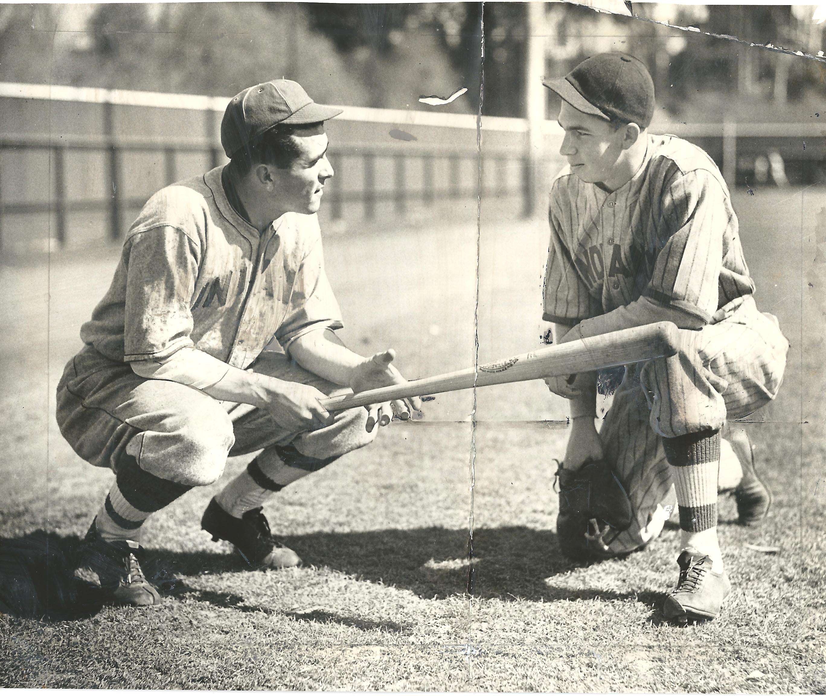 a man holding a baseball bat