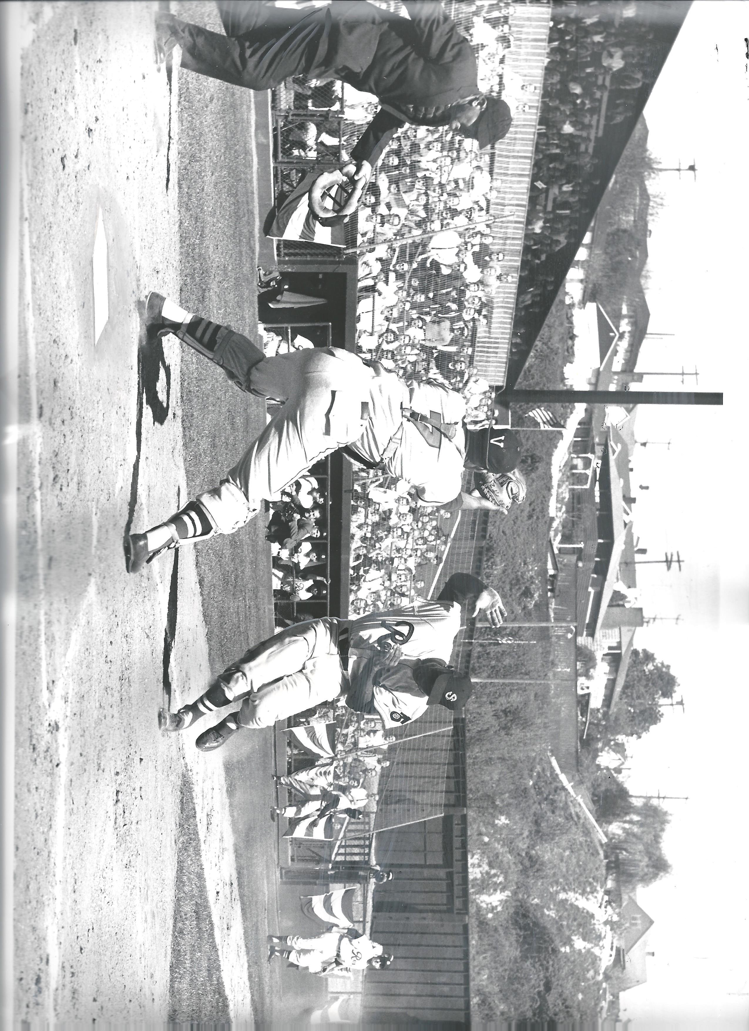 a baseball player holding a bat on a field