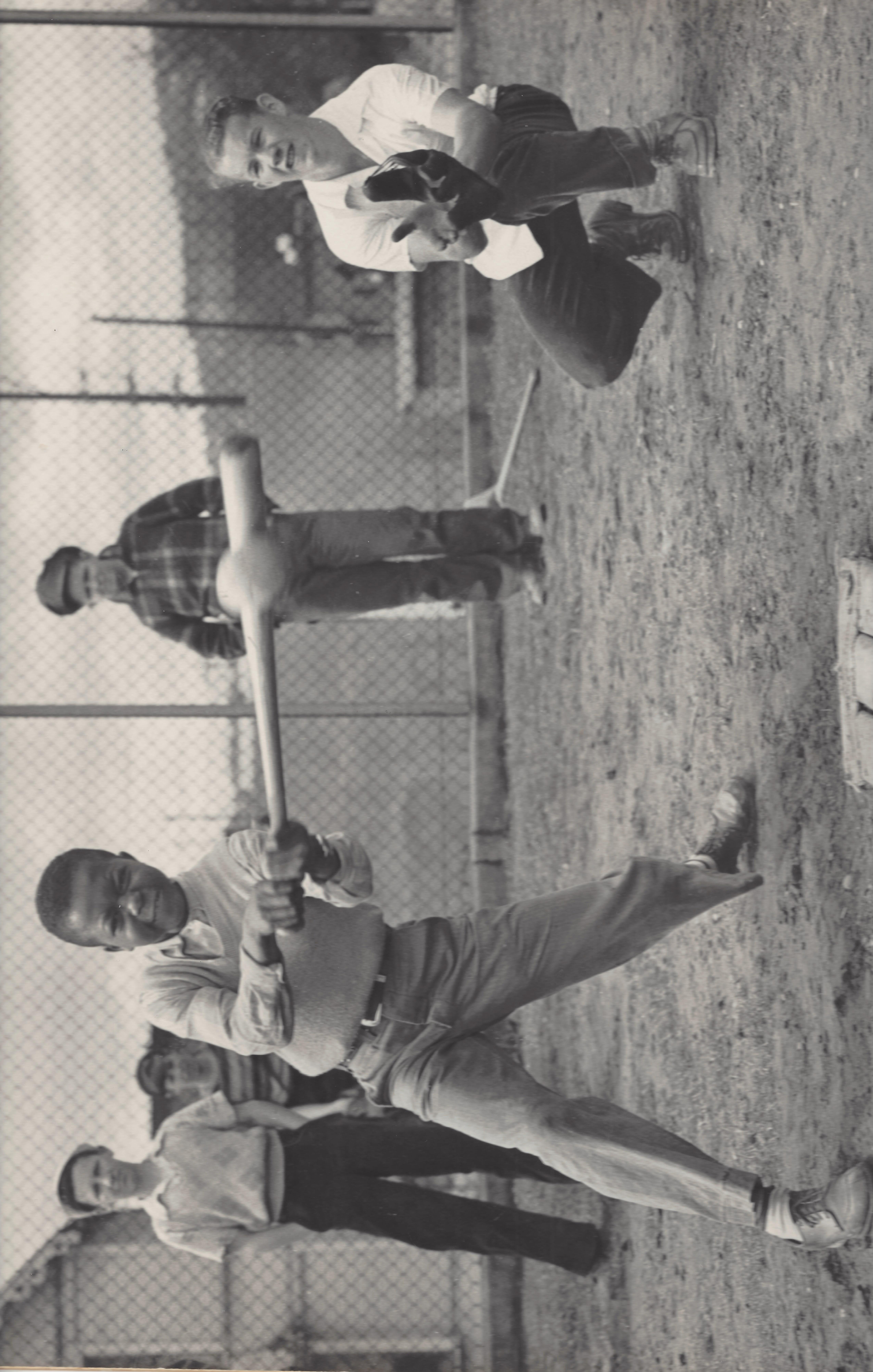 a group of young men playing a game of baseball