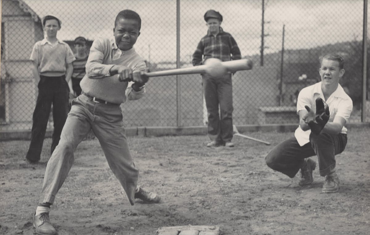 a group of young men playing a game of baseball