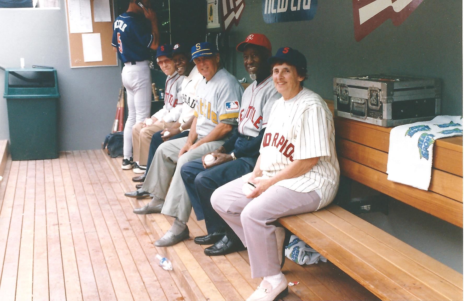 a group of people sitting on a bench