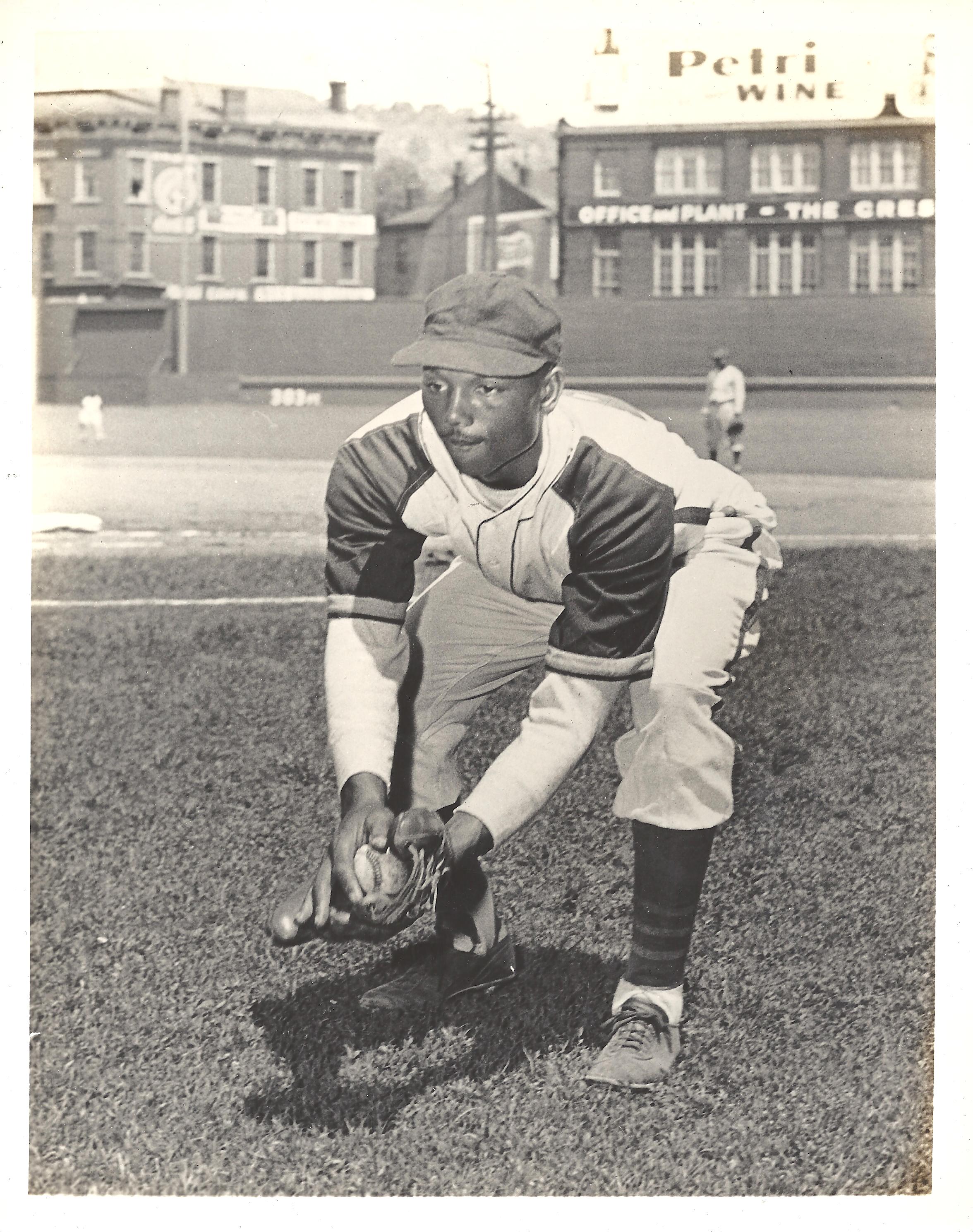 a vintage photo of a baseball player posing for the camera