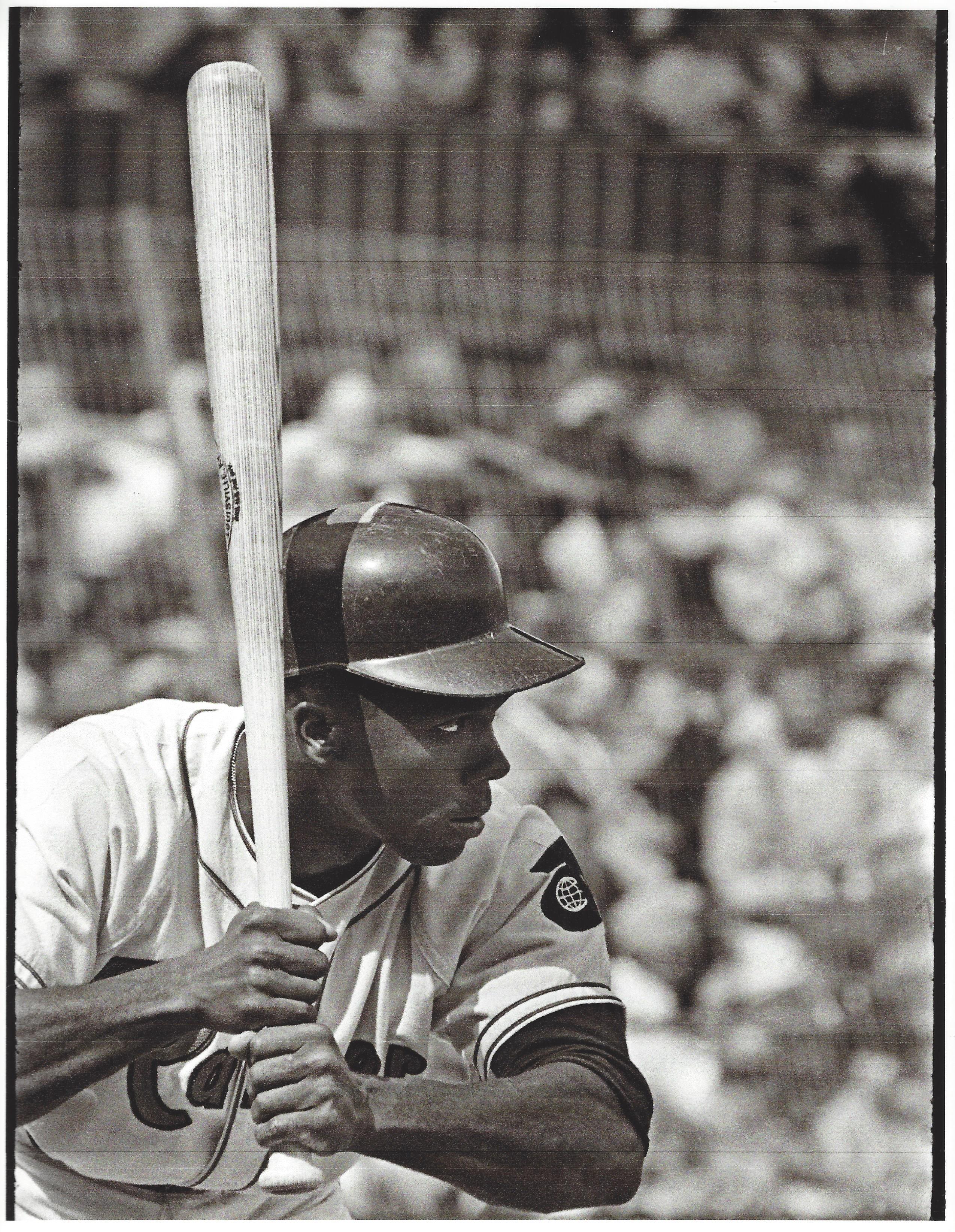 a man holding a baseball bat