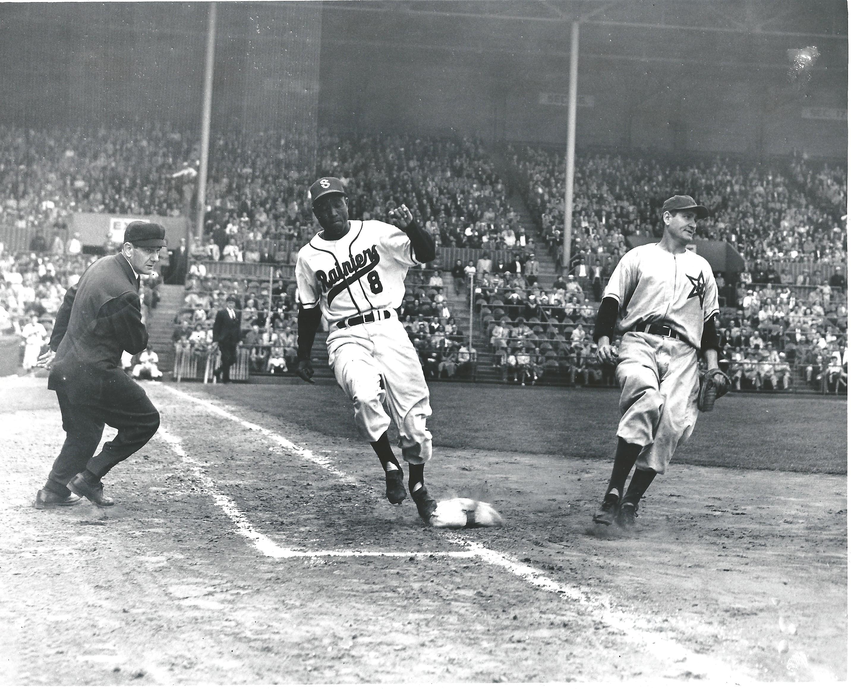 a group of men playing a game of baseball