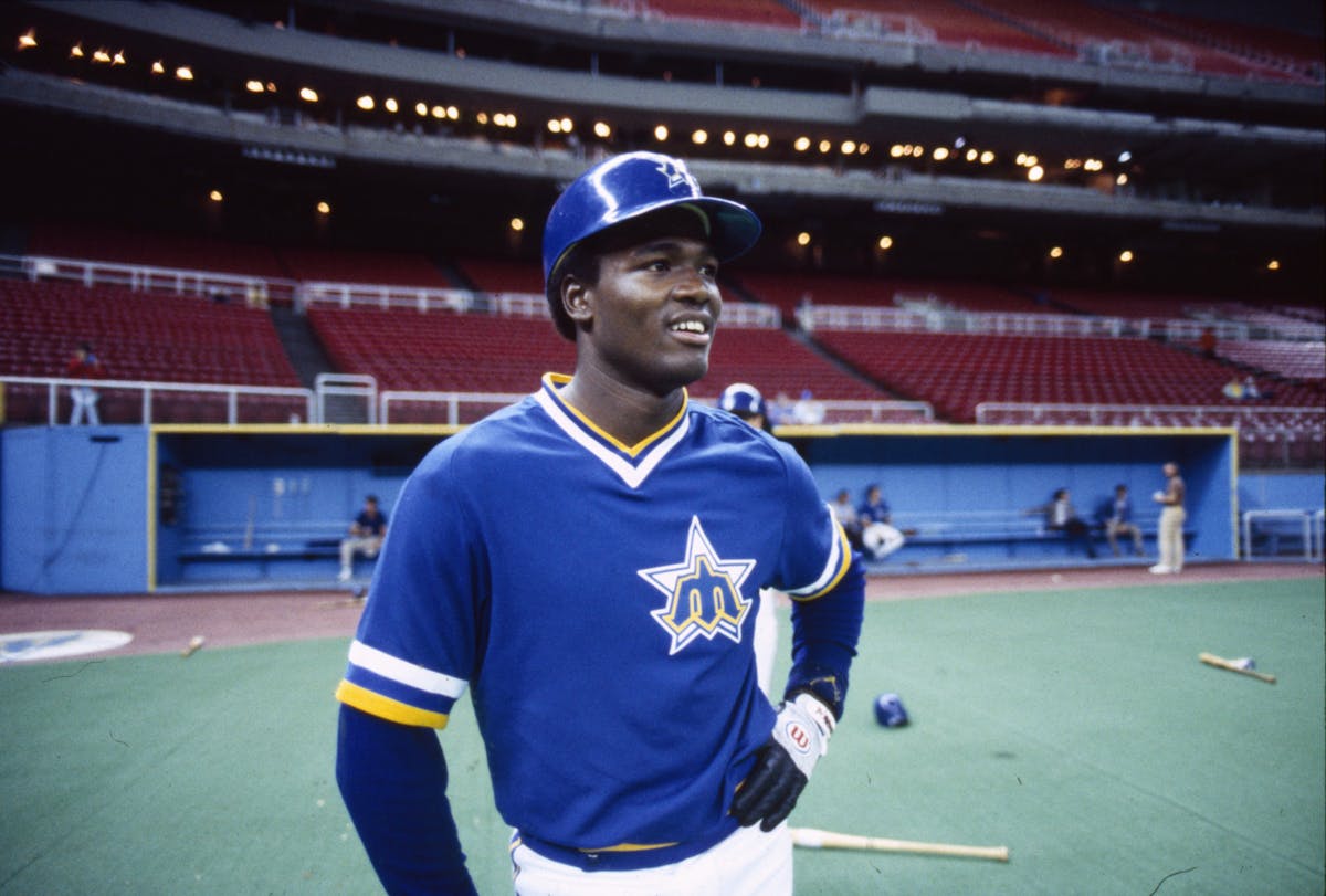 Harold Reynolds standing on a baseball field