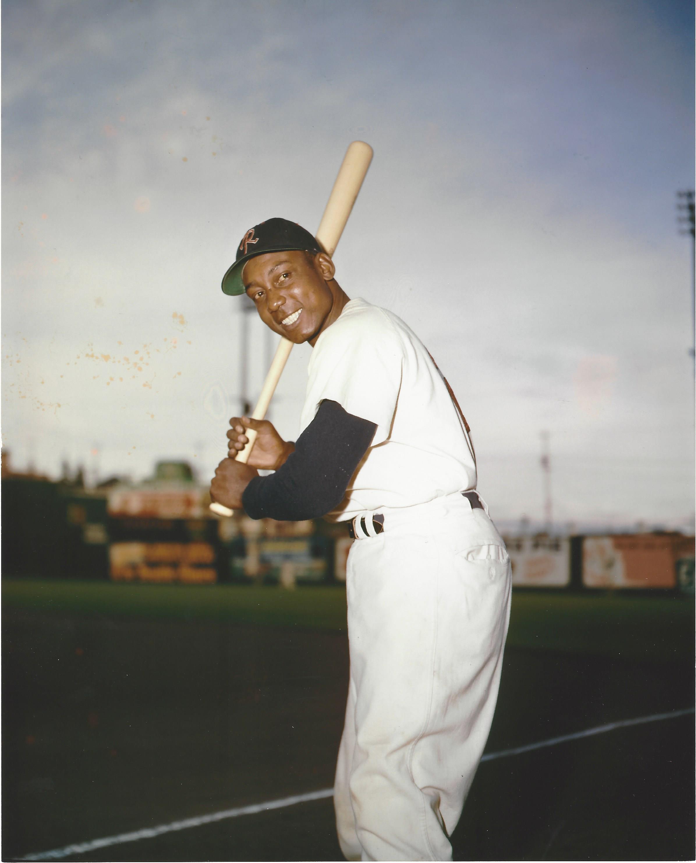 a man holding a baseball bat