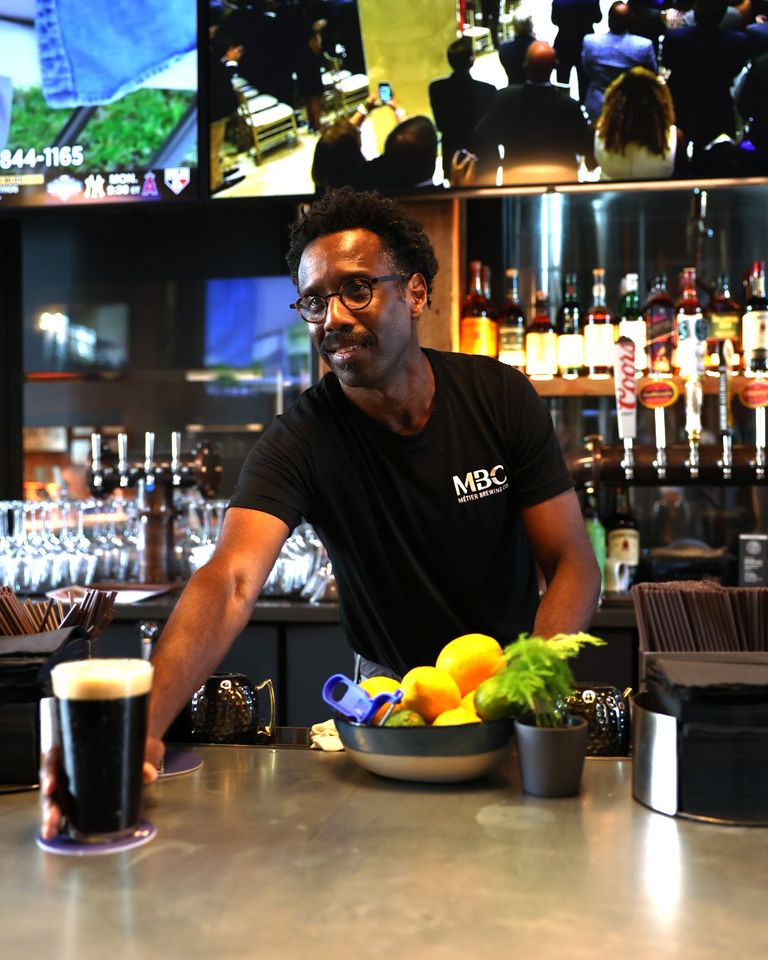 a man sitting at a table in a restaurant