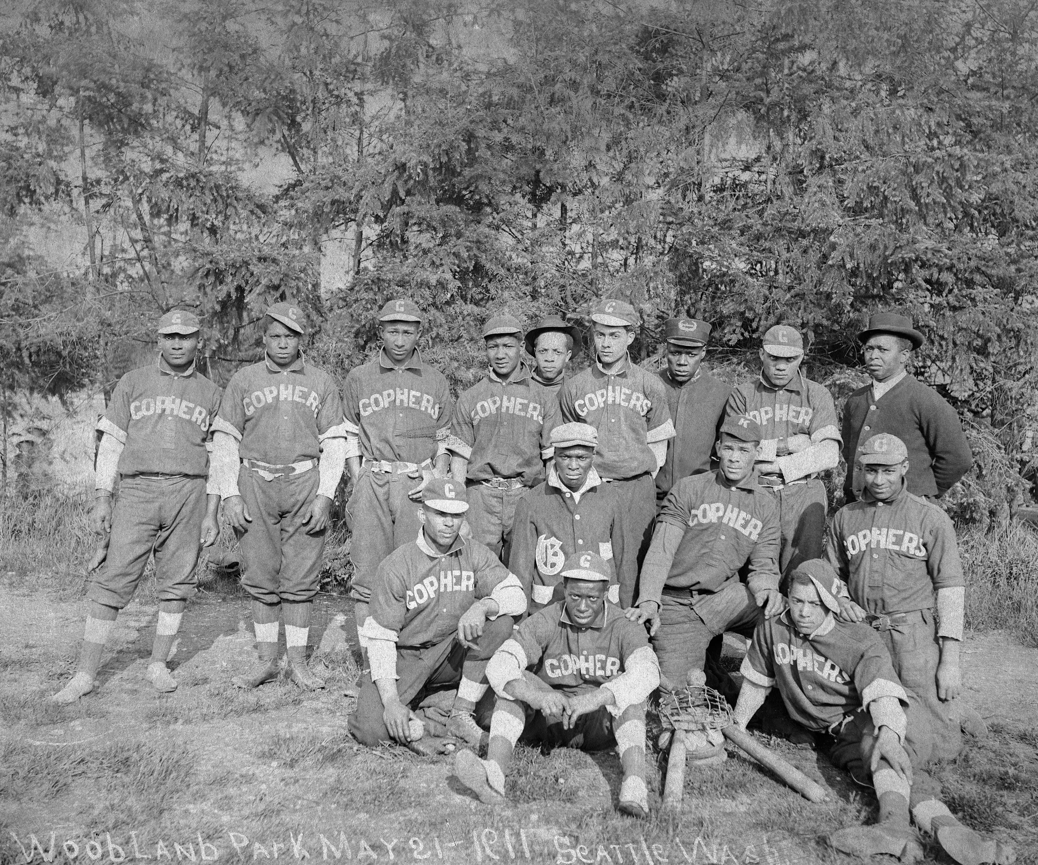 a group of baseball players posing for a photo