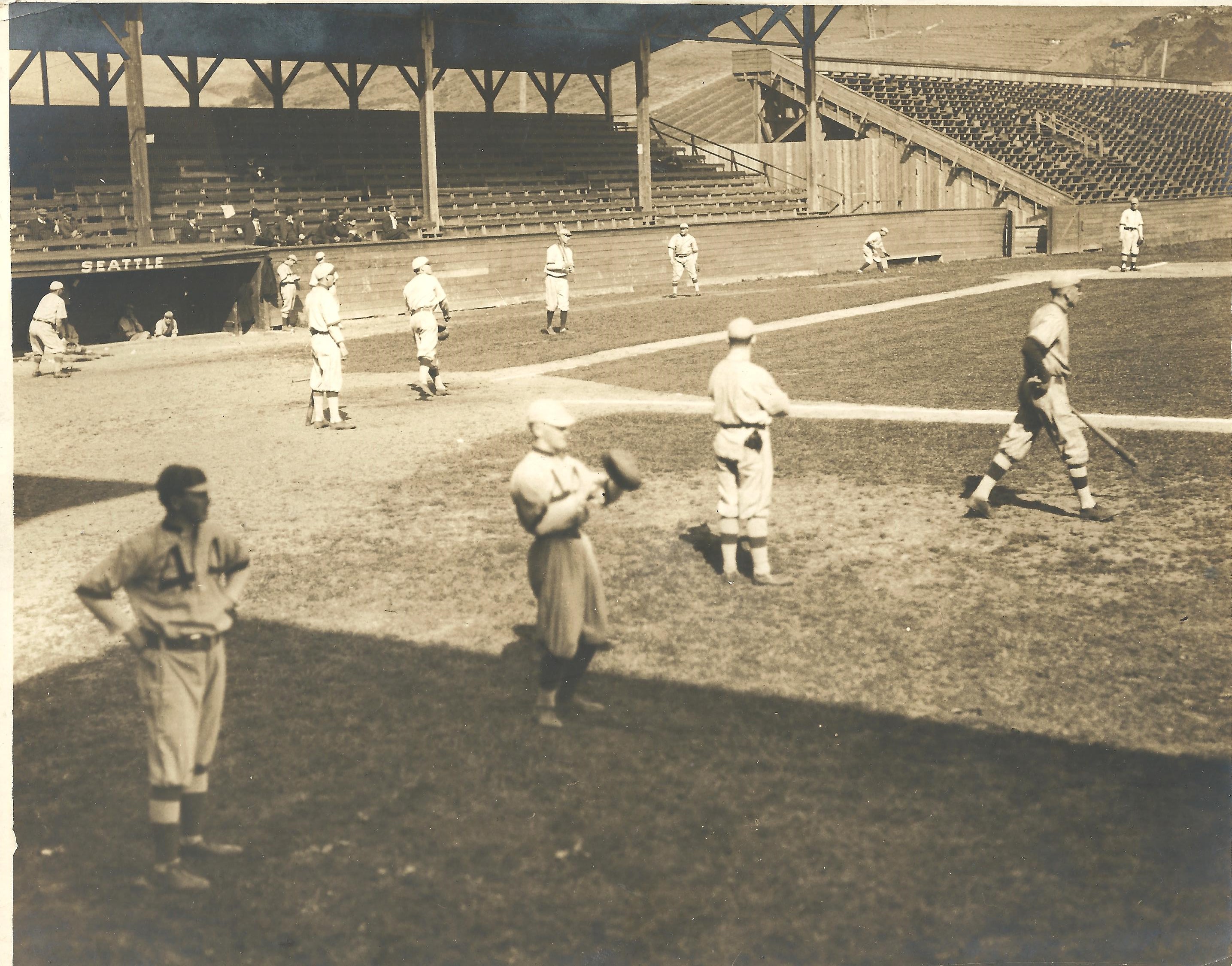 a group of people standing in front of a fence