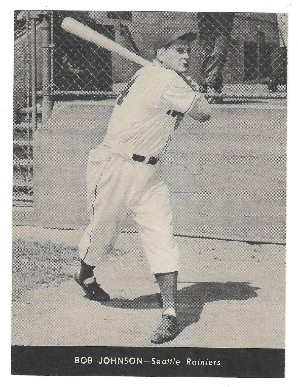 a vintage photo of a baseball player holding a bat