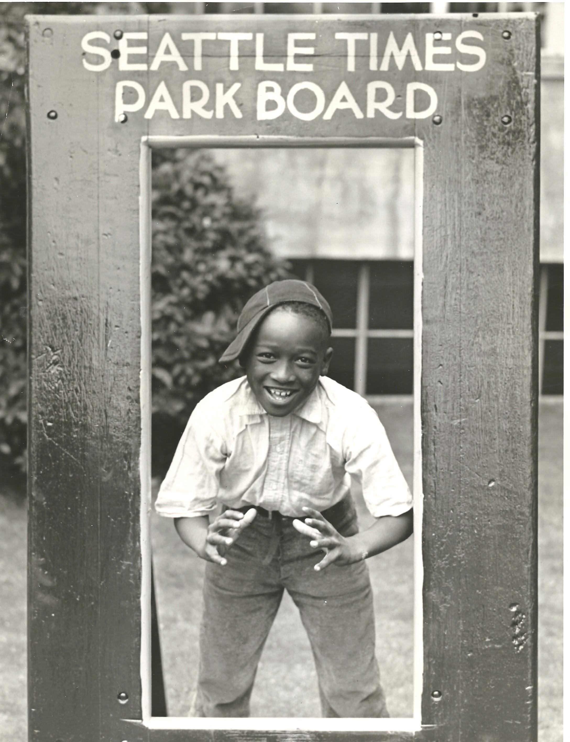 a man standing in front of a sign