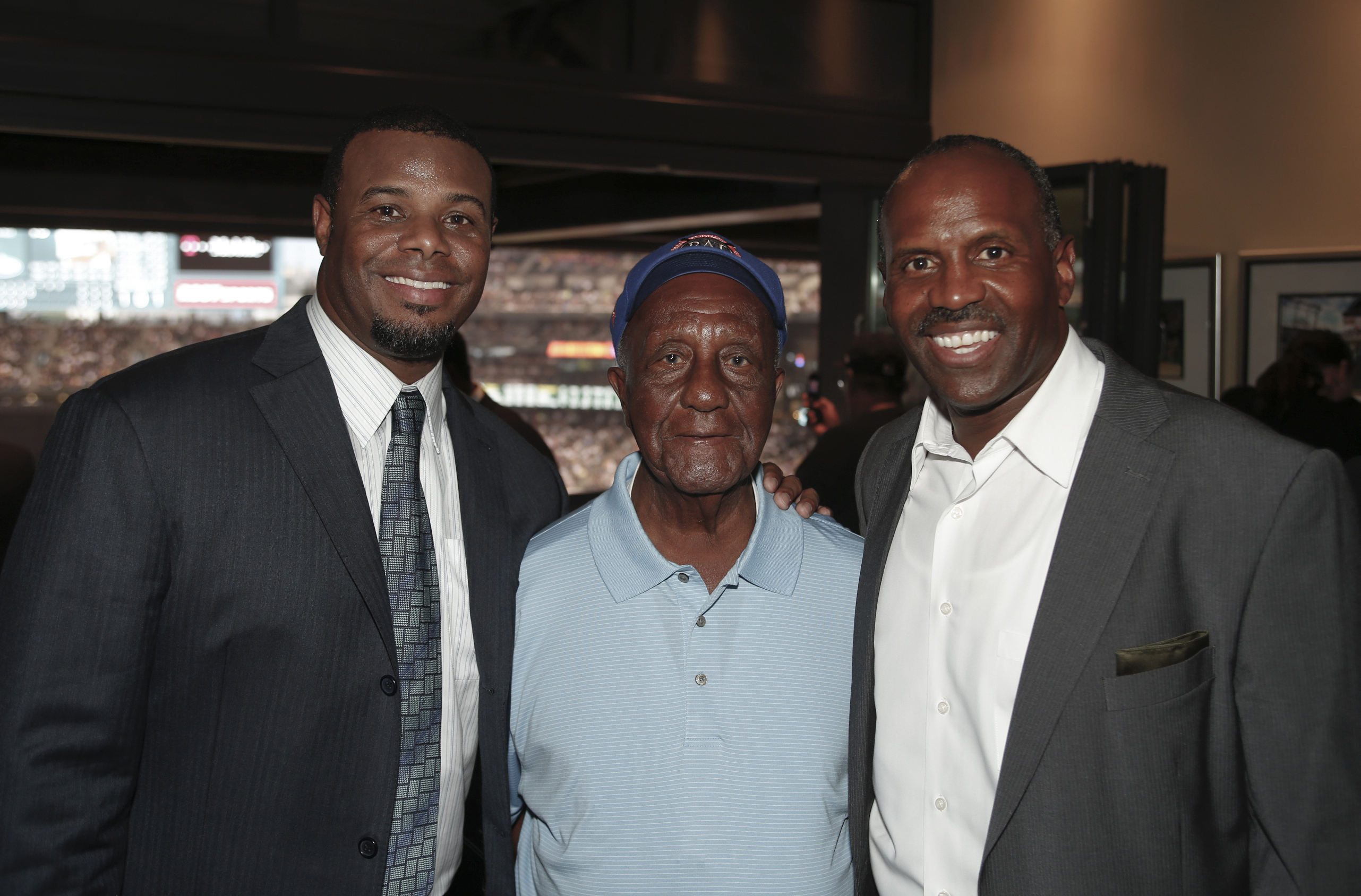 Ken Griffey Jr., Alvin Davis posing for the camera