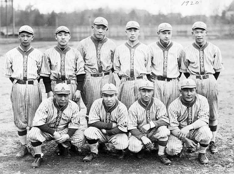 a group of baseball players posing for a photo