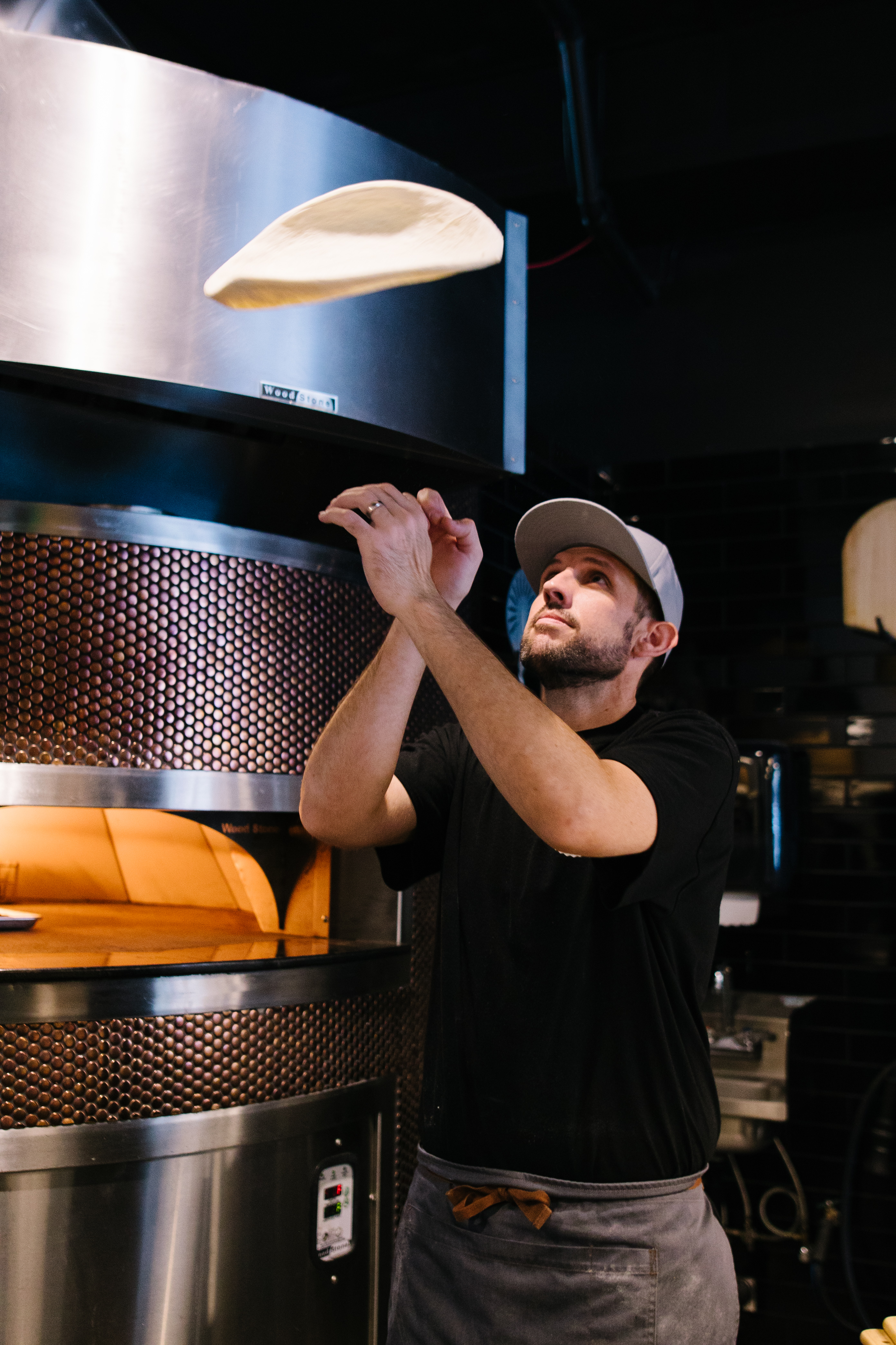 a man standing in front of a stove
