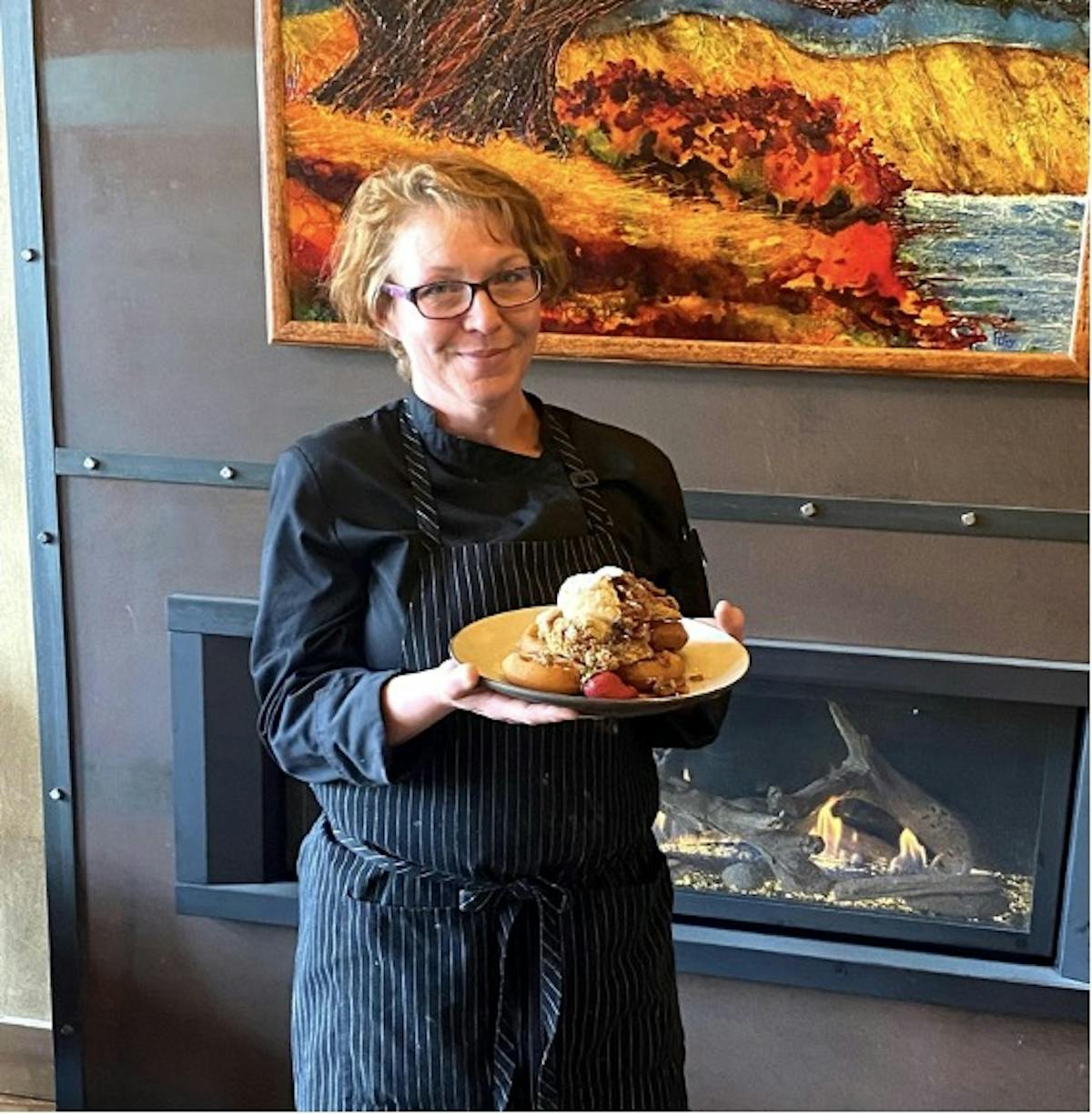 a person holding a plate of food