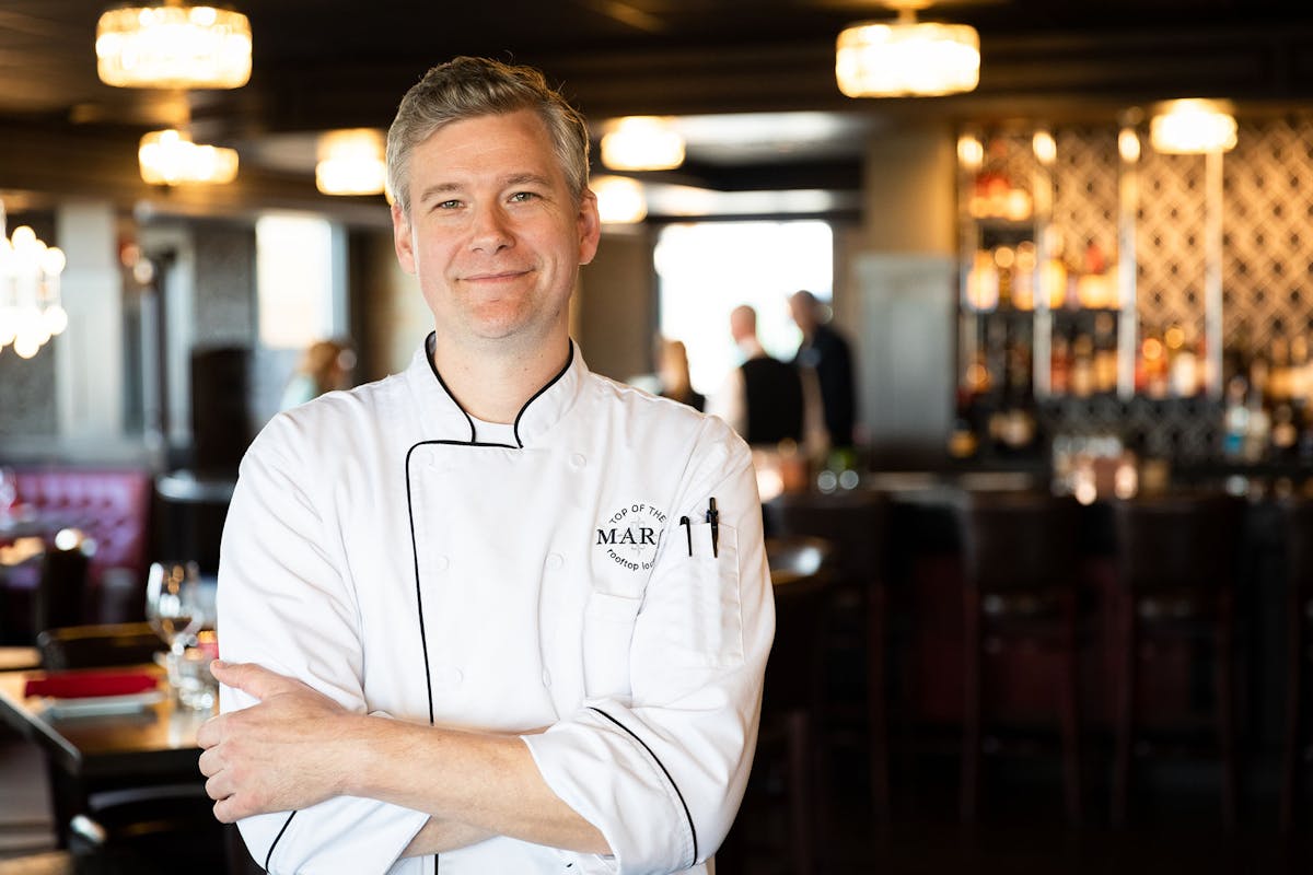 a man standing in a kitchen