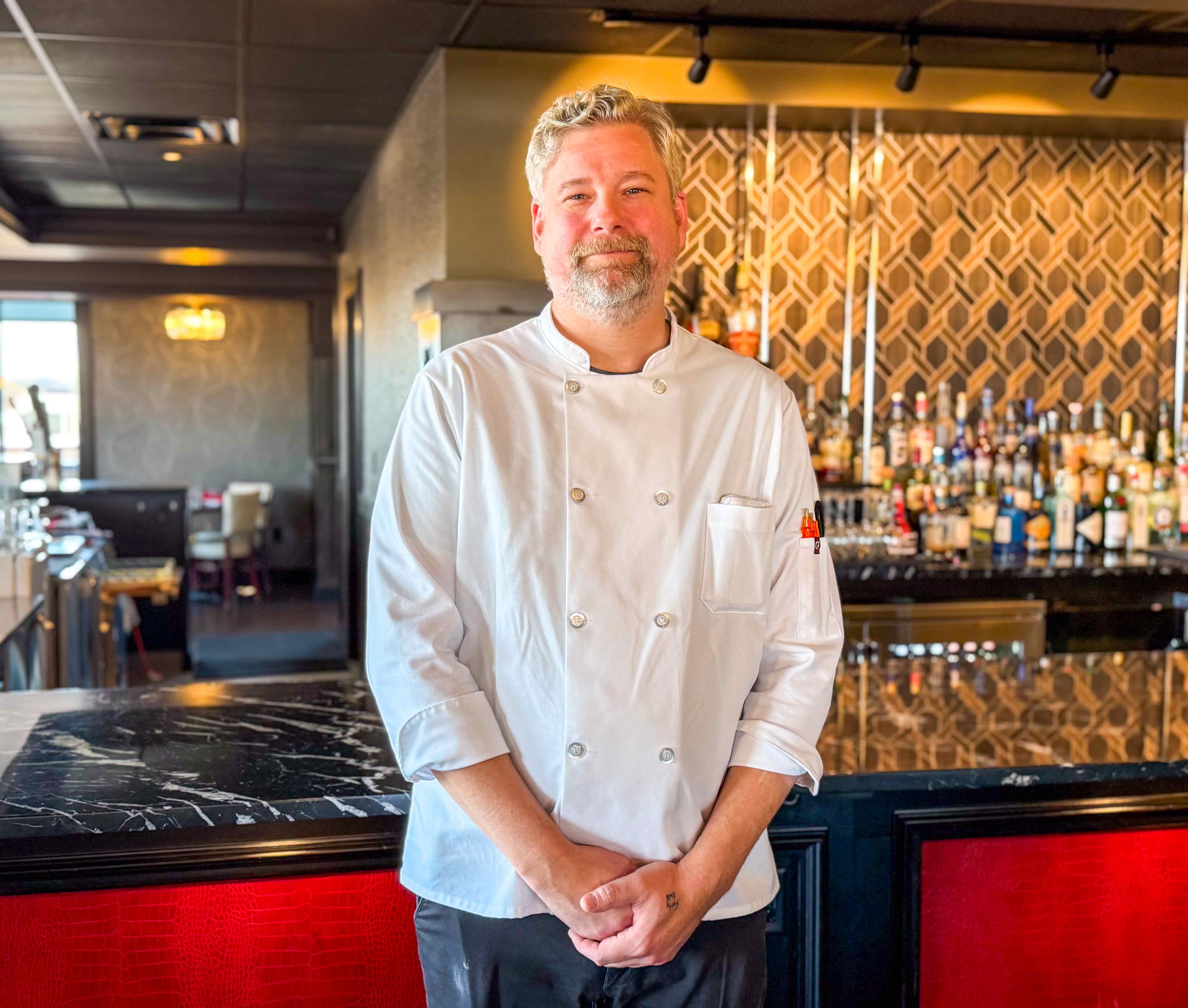 a man standing in a kitchen