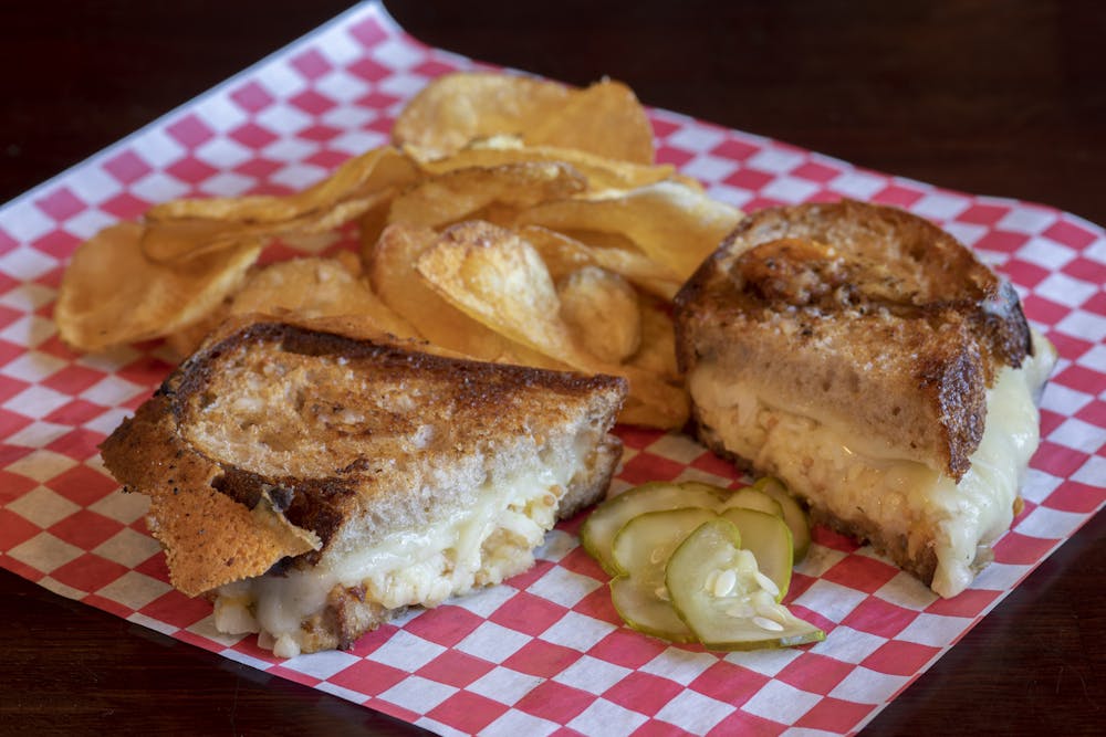 a sandwich sitting on top of a paper plate