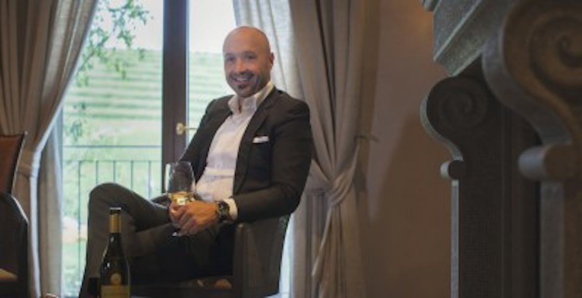 a person standing in front of a curtain