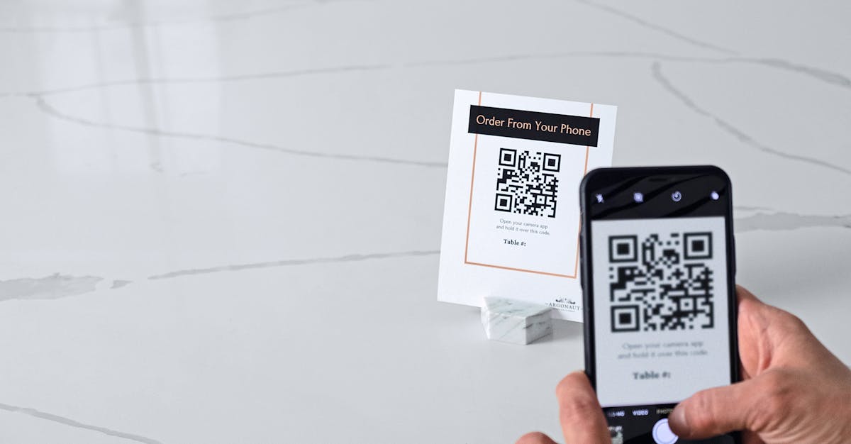 scanning QR code sign in a marble holder