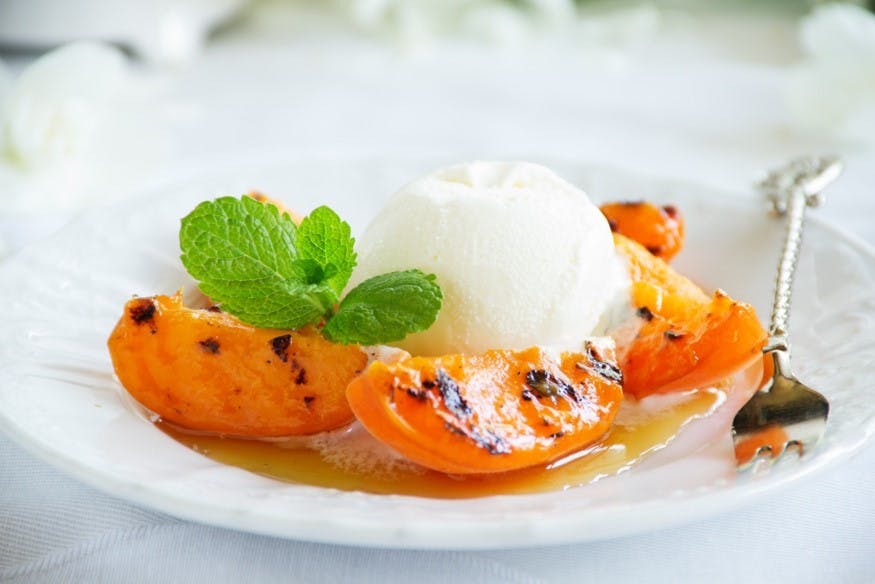 Flambed peach with vanilla ice cream