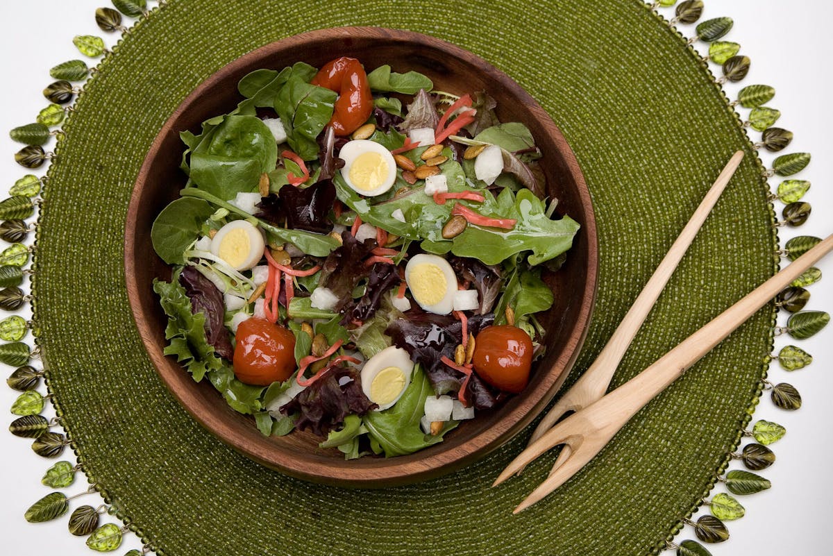 a bowl of salad on a plate