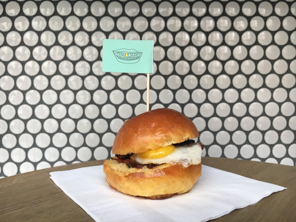 an egg sandwich sitting on top of a table