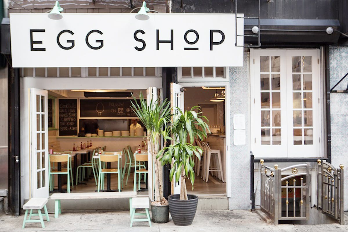 a store front with an egg shop sign