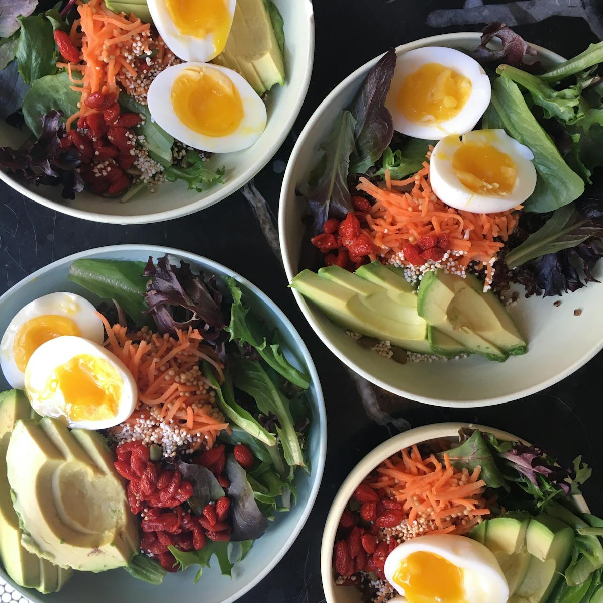 a bowl filled with different types of food on a plate