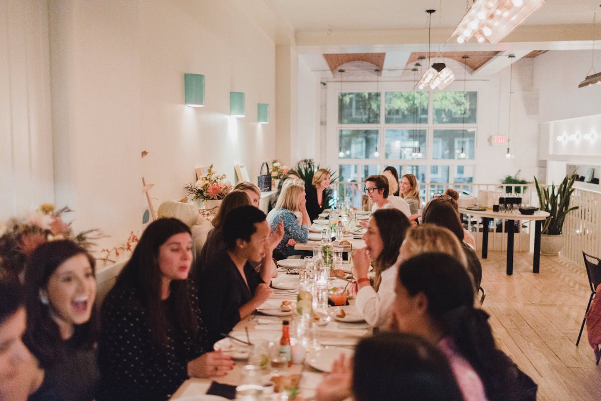 a group of people sitting at a table