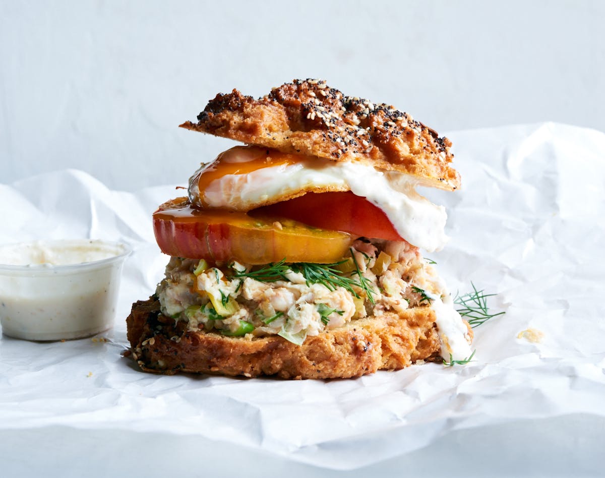 a sandwich sitting on top of a paper plate