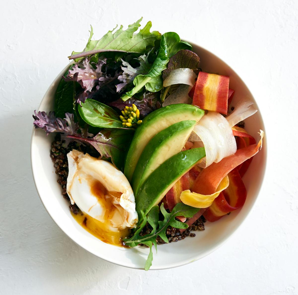 a bowl of salad on a plate