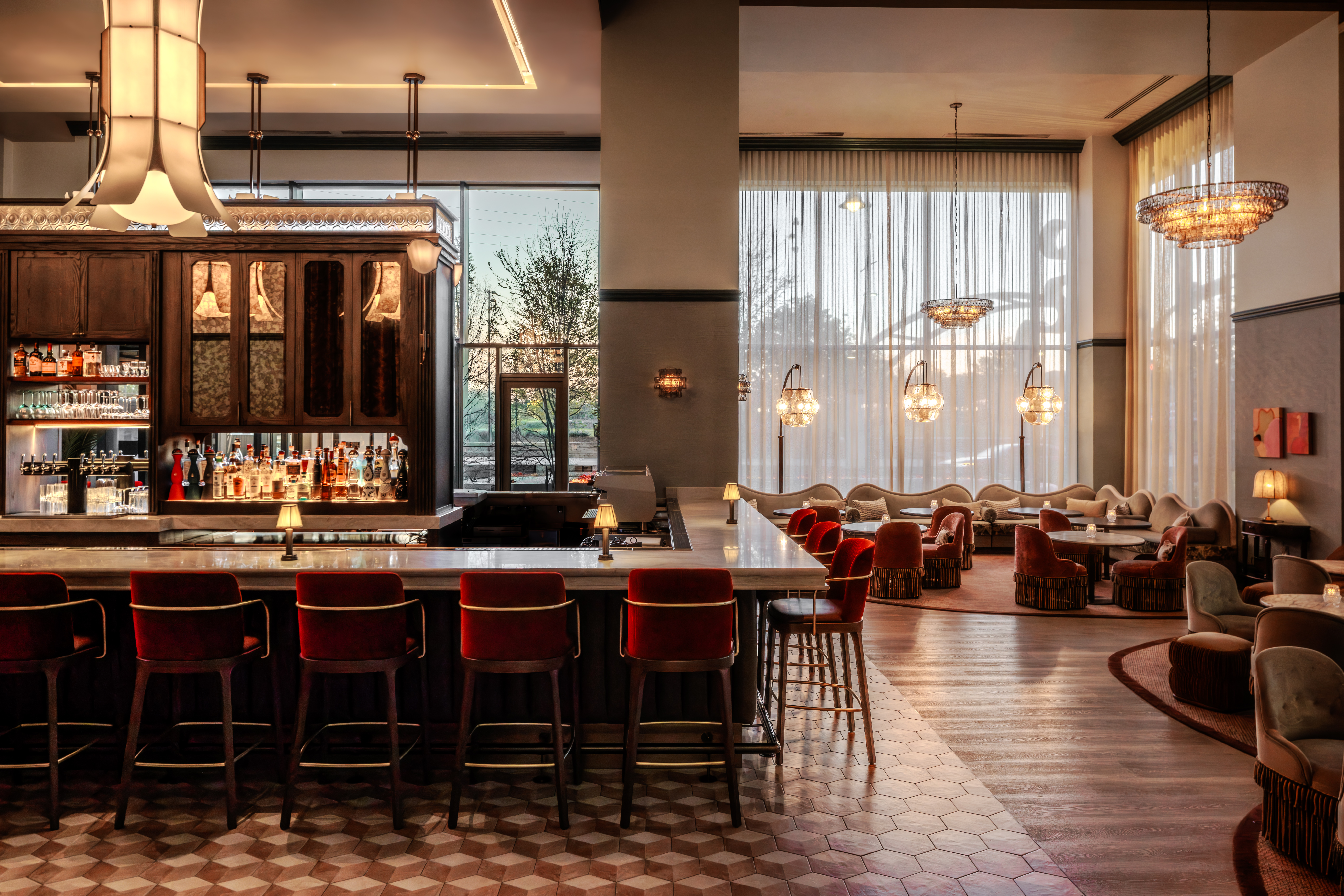 a bar with chairs and a long counter