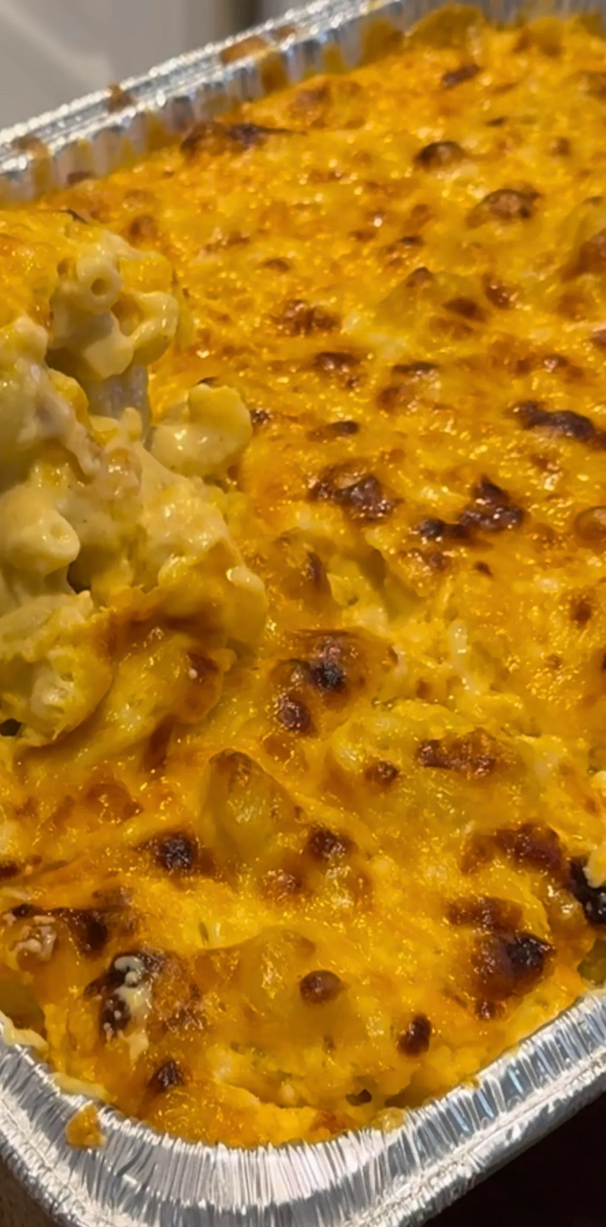 a close up of a pizza covered in cheese