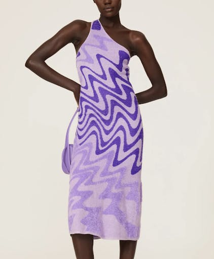 a woman wearing a purple dress