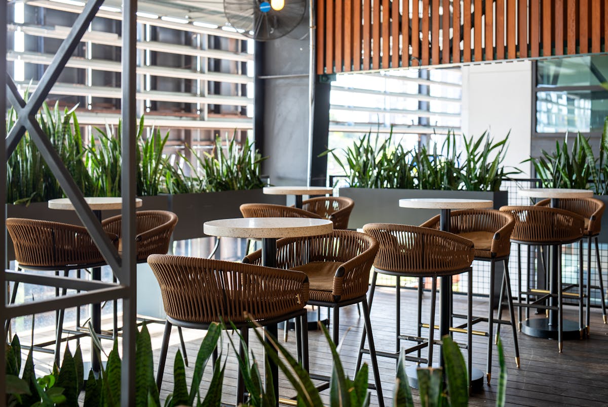 a dining room table in front of a fence