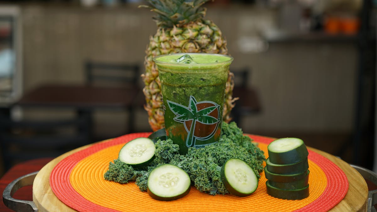 a juice in a glass on a table