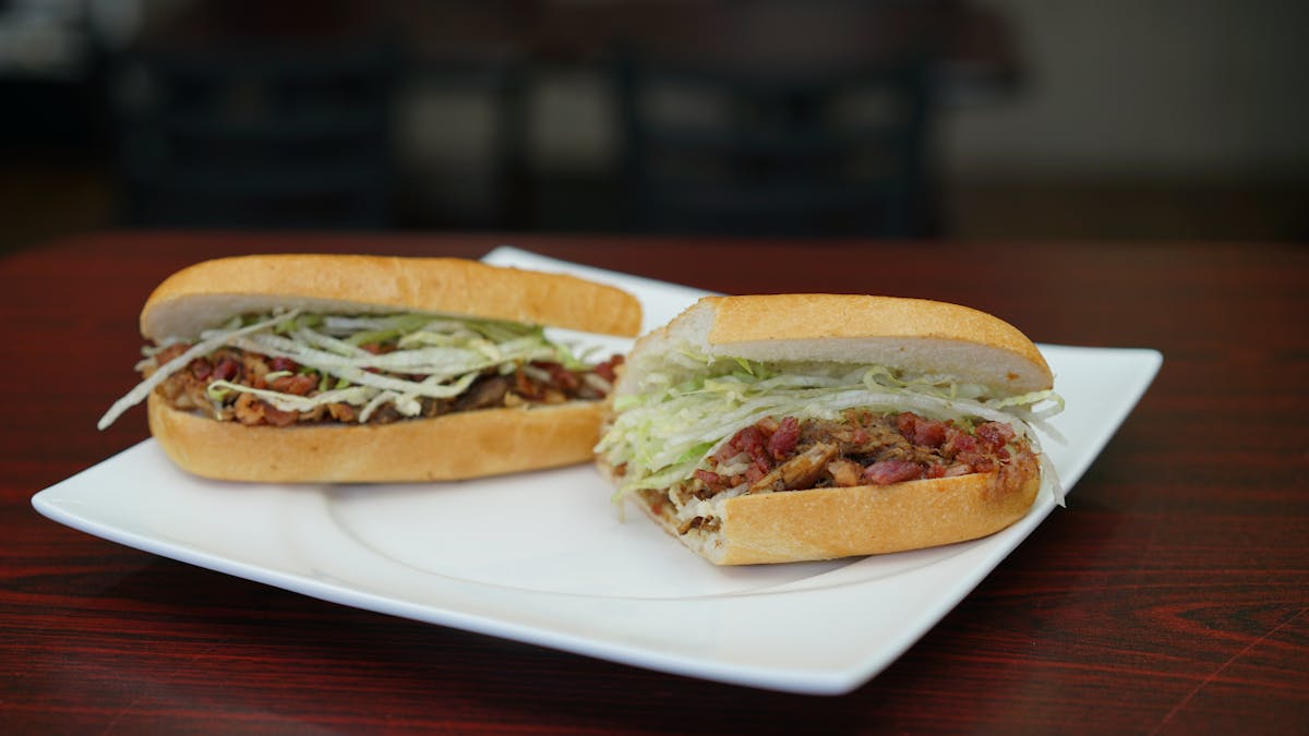 a close up of a sandwich on a plate on a table